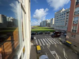 a view of a parking lot from a building at Torre 15 in A Coruña