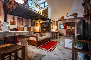 a living room with a couch and a fireplace at Santa Fiora Ospitalità Diffusa - Il Camino in Santa Fiora