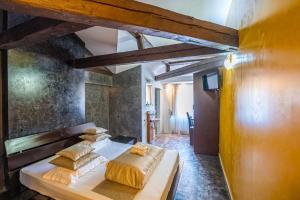 Postel nebo postele na pokoji v ubytování Do Stil Boutique Hotel
