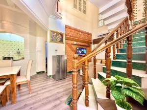 a kitchen and dining room with stairs and a table at Yepplo Holiday Home - BANGALORE - 3BHK Private Villa with complimentary breakfast in Bengaluru