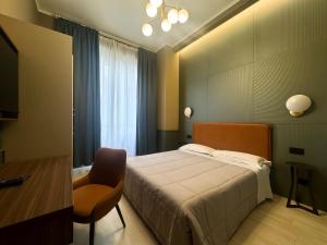 A bed or beds in a room at The B Place