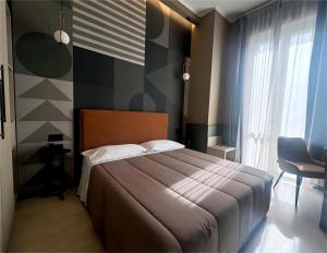 A bed or beds in a room at The B Place