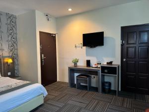 TV a/nebo společenská místnost v ubytování K Garden Hotel (BS)