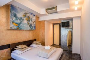 Postel nebo postele na pokoji v ubytování Do Stil Boutique Hotel