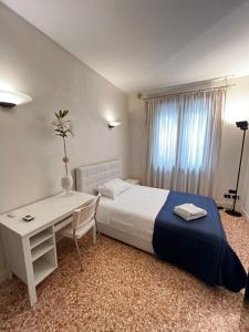 Postel nebo postele na pokoji v ubytování Locazione Turistica Joyful Padova