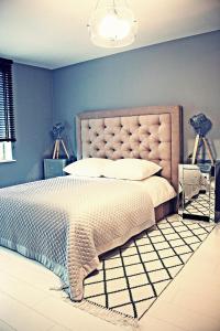 
Łóżko lub łóżka w pokoju w obiekcie Hamak Apartamenty

