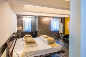 Postel nebo postele na pokoji v ubytování Do Stil Boutique Hotel