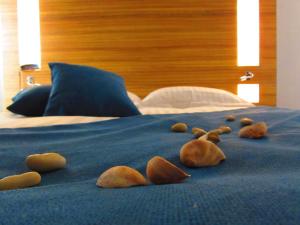 a group of stuffed animals laying on a bed at Brit Hotel & Spa Saint Brieuc Plérin in Plérin