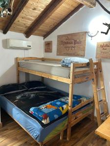 a bunk bed room with two bunk beds at Mansarda IGUANA in CTA +8 photos
