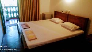 Postel nebo postele na pokoji v ubytování Village Inn