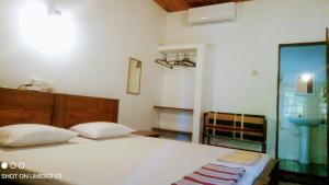 Postel nebo postele na pokoji v ubytování Village Inn