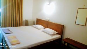 Postel nebo postele na pokoji v ubytování Village Inn