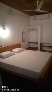 Postel nebo postele na pokoji v ubytování Village Inn