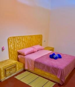 Postel nebo postele na pokoji v ubytování Hôtel Khalwa