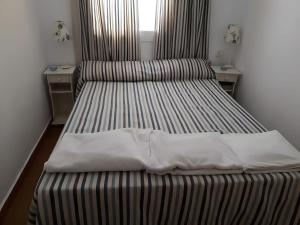 1 Linea Playa , 3 Dorm Islantilla客房内的一张或多张床位