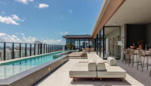 a swimming pool on the roof of a building at Alive Corredor da Vitória - Vista Mar in Salvador
