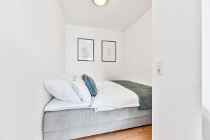 Postel nebo postele na pokoji v ubytování COZY stilvolles Apartment, Nähe BASF, BG Klinik + 25 fotografií