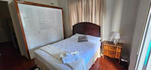 Ένα ή περισσότερα κρεβάτια σε δωμάτιο στο The M4 Elegant 3 bedroom home in Port of Spain +28 φωτογραφίες