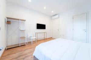 Televiisor ja/või meelelahutuskeskus majutusasutuses Zuli's Rooms