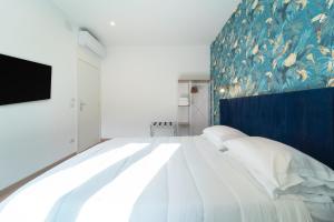 Voodi või voodid majutusasutuse Zuli's Rooms toas