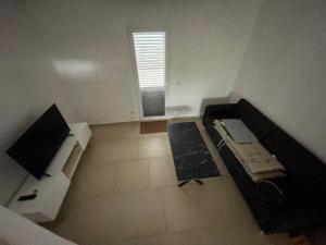 an empty room with a bed and a window at Amanda C in Starigrad