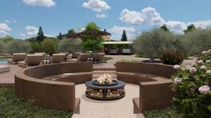 a patio with a fire pit and a fire hydrant at Casa dei fiori in Asprovalta
