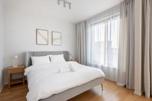 Postel nebo postele na pokoji v ubytování Fresh All-in Apartment Prague