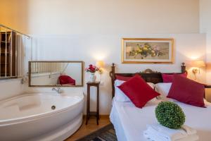 A bed or beds in a room at Corte Cristina & Suites