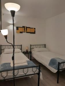 Posteľ alebo postele v izbe v ubytovaní G House Dolceacqua