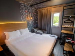 Postel nebo postele na pokoji v ubytování ibis Curitiba Batel