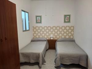 Giường trong phòng chung tại Casa Manuel Mirador Aeropuerto