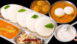 a table with four trays of different types of food at DSquare omr BY K Hotels in Chennai