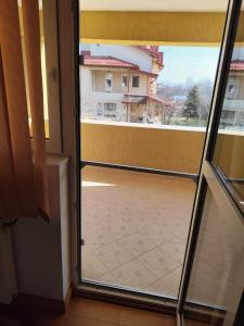 a sliding glass door with a view of a balcony at Vila Elena in Bucharest