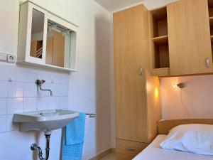 Postel nebo postele na pokoji v ubytování Apartments Volaric