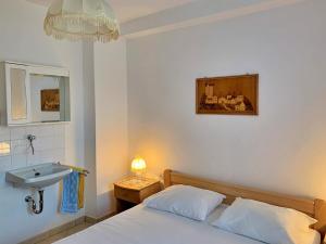 Postel nebo postele na pokoji v ubytování Apartments Volaric