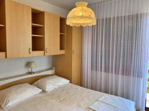 Postel nebo postele na pokoji v ubytování Apartments Volaric