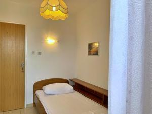 Postel nebo postele na pokoji v ubytování Apartments Volaric