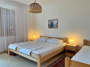 Postel nebo postele na pokoji v ubytování Apartments Volaric