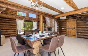 a dining room with a table and chairs at Vacation home Elizabeta in Slunj