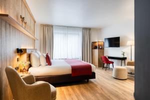 Ліжко або ліжка в номері Hotel du Commerce
