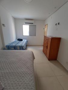 Ένα ή περισσότερα κρεβάτια σε δωμάτιο στο Praia da Guilhermina-PG