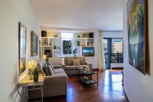 a living room with a couch and a table at Beach and View Arguineguin MG by VillaGranCanaria in Arguineguín
