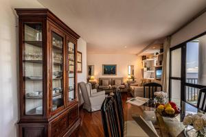 a living room with a dining table and a living room with at Beach and View Arguineguin MG by VillaGranCanaria in Arguineguín