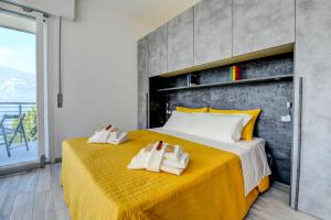 Postel nebo postele na pokoji v ubytování Studio LAGO - Holiday Apartments Brenzone