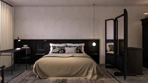 a bedroom with a large bed and a desk at Abella Suites Embonas in Émbonas