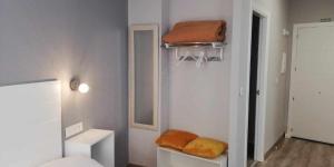 Posteľ alebo postele v izbe v ubytovaní Apartamentos Harmonia