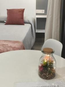 Posteľ alebo postele v izbe v ubytovaní Apartamentos Harmonia