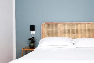 Ένα ή περισσότερα κρεβάτια σε δωμάτιο στο Ruote Libere Bed&Breakfast