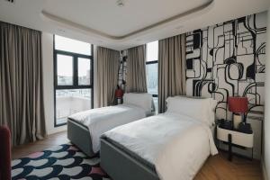 Letto o letti in una camera di The Muse
