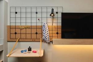 a table with two pairs of scissors on a wall at Moxy Annecy in Annecy